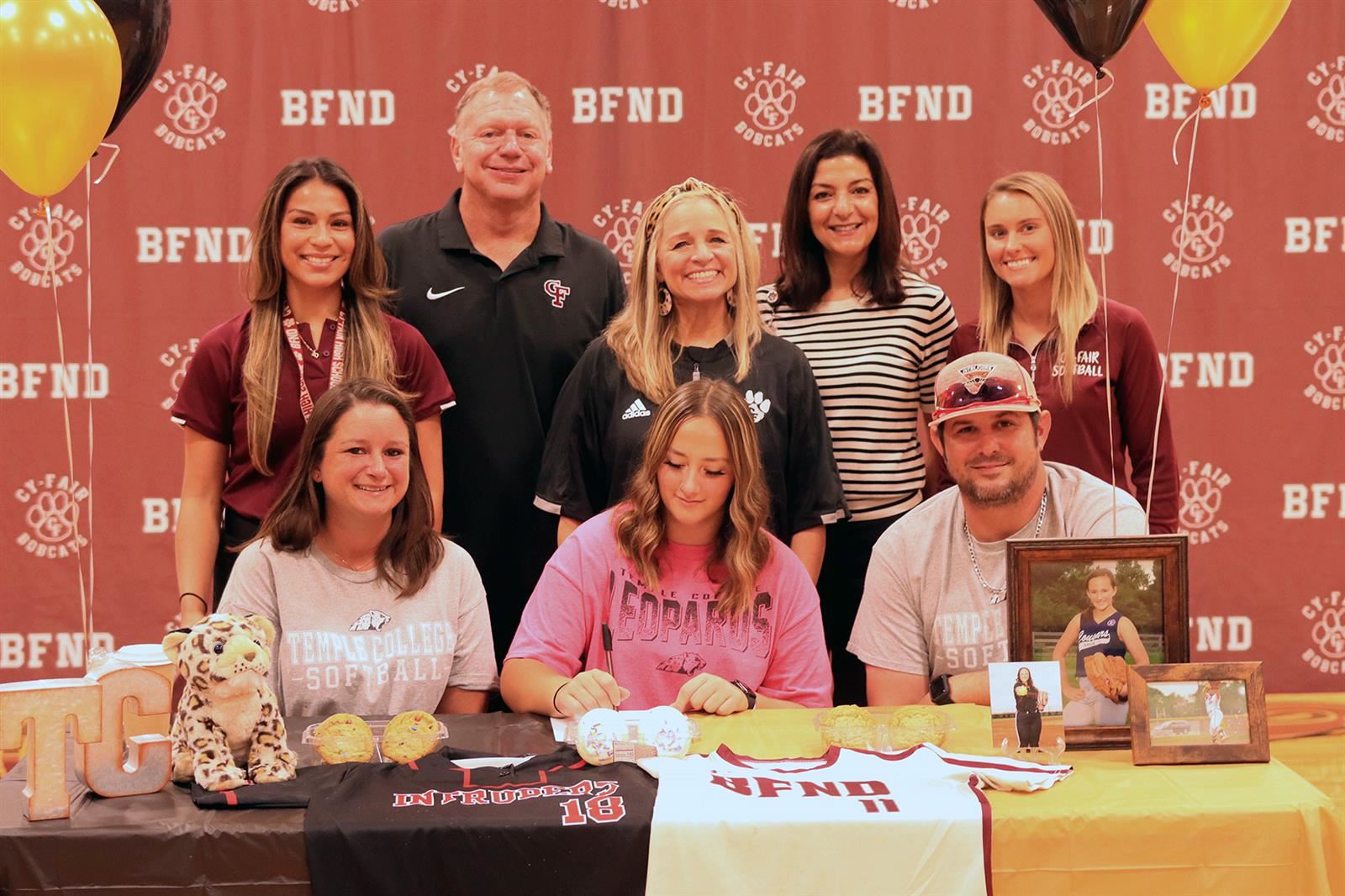 Cy-Fair High School senior Dalanee Ekster, seated center, signed a letter of intent to play softball at Temple College.